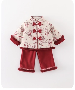 Detail of baby girl traditional New Year outfit with red floral embroidery and faux fur trim