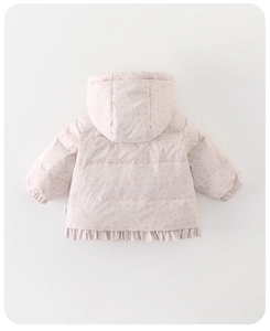 Detail view of pink floral baby winter coat featuring ruffled hem and hood back design