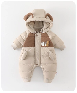 Detail of baby winter romper showing bear ear hood and quilted thermal fabric