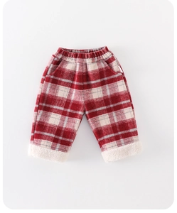 Detailed close-up of girls winter plaid trousers with thick white fleece lining