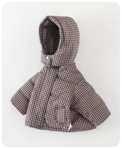 Close-up of baby winter down jacket showing brown gingham pattern and snap button detail