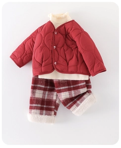 Detailed view of red quilted jacket and plaid pants with warm fleece lining for kids