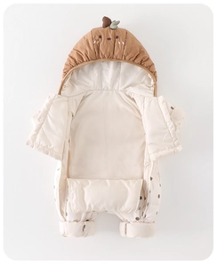 Close-up of baby winter romper featuring a cute fruit-shaped hood with green leaf and embroidery