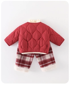 Detailed view of red quilted puffer jacket and checkered warm pants for baby girls
