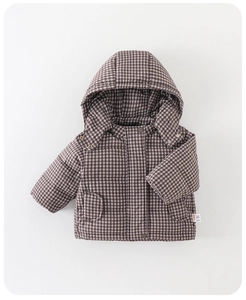 Close-up of quilted warm hooded jacket for toddlers in brown and white checkered pattern