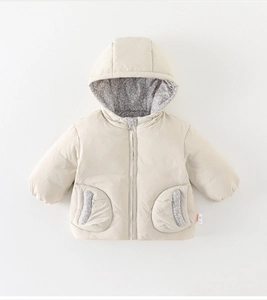 Detail of baby winter down coat featuring floral lining in the hood and beige fabric
