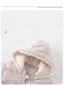 Detail of baby floral puffer jacket showing hood, zipper and quilted stitching texture
