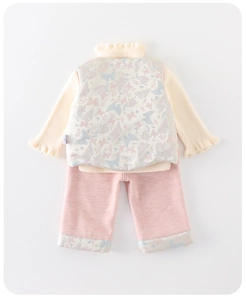 Detailed view of winter baby girl set with floral satin vest and pink knit pants