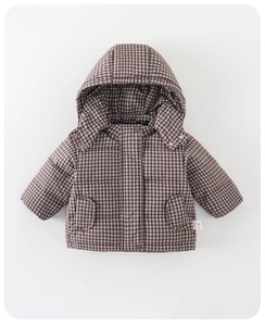Macro detail of infant winter down jacket showing brown gingham pattern and snap buttons