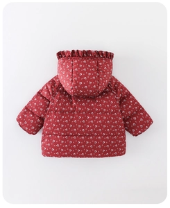 Detail of red floral baby puffer jacket with ruffled hood and white flower patterns