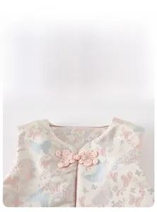 Close-up of traditional Chinese butterfly jacquard fabric and handmade pearl button knot