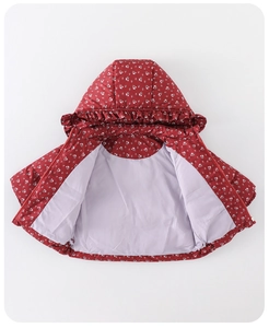 Close-up of floral baby winter coat featuring ruffled hood trim and soft purple lining