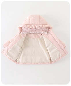 Detail view of pink baby winter coat featuring ruffled hood trim and floral lining fabric