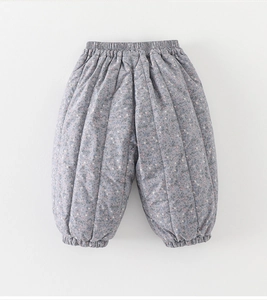 Detail of quilted floral pattern and elastic waistband on baby winter warm pants