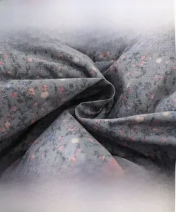 Close-up of high-density soft fabric with floral pattern for thermal baby trousers