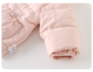 Detail view of elasticated cuffs and pocket buttons on a pink padded baby down jacket