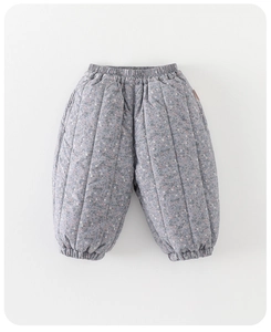 Detail view of quilted baby winter trousers with delicate pink floral pattern and elastic waist