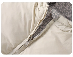 Detail view of premium silver metal zipper and floral lining on baby winter puffer jacket