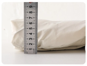 Detail showing the 7.5cm thickness of this warm baby winter down jacket for cold weather