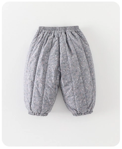 Close-up of quilted floral thermal pants for toddlers with elastic cuffs and waist