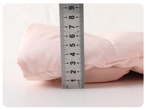 Detailed view showing the 6.5cm thickness measurement of the pink quilted baby down jacket