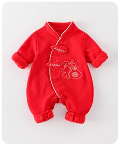 Close-up of red newborn bodysuit with traditional Fu embroidery and snap buttons