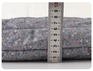 Detailed view showing the 7cm thickness of baby quilted floral pants with soft lining