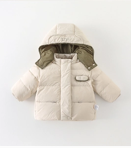 Detailed view of winter baby hooded jacket with cream fabric and olive green inner lining