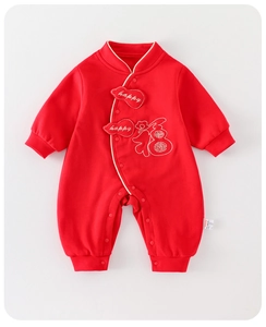 Detail of newborn baby red winter romper with lucky embroidery and snap buttons