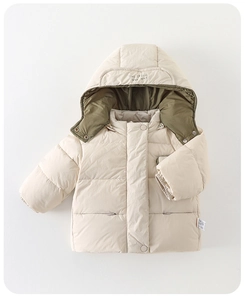 Detailed flat lay of a padded baby winter jacket with quilted texture and snap buttons