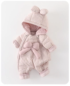 Close-up of pink floral baby winter romper with cute 3D ears and a large bow detail