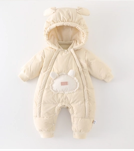 Detailed close-up of winter baby romper featuring a cute bear hood and rabbit pocket design