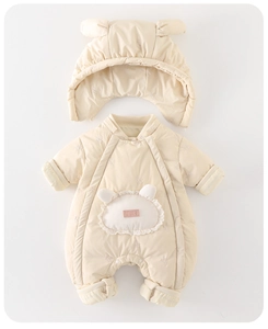 Close-up of quilted baby romper with warm fleece lining and cute animal pocket detail