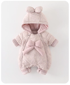 Detailed close-up of pink floral baby winter romper featuring large decorative bow and zippers