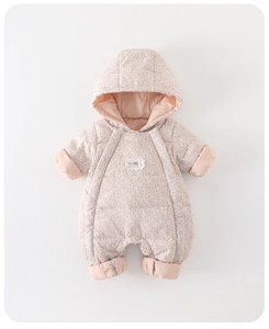 Detail of baby floral hooded romper featuring quilted warm fabric and a lace bow accent
