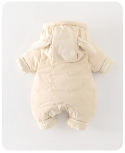 Detailed back view of beige quilted infant romper with 3D bunny ears and embroidery