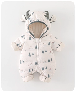 Detailed view of winter baby romper featuring festive reindeer and pine tree prints