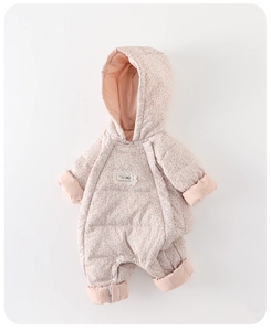 Detailed view of baby girl snowsuit with pink floral pattern and soft warm hooded design