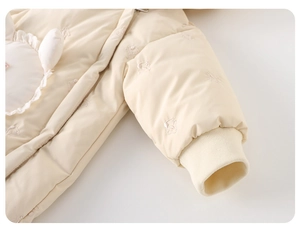 Detail of baby winter romper sleeve with rabbit embroidery and thick ribbed cuffs