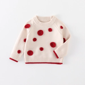 Thick knit baby sweater in cream with red crochet dots and ribbed trims for winter