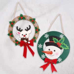 Christmas wooden door signs with reindeer and snowman designs and red bows