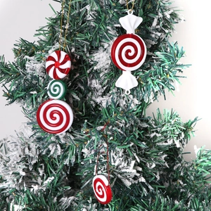 Red and white peppermint candy Christmas tree ornaments with golden strings