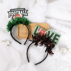 Super Bowl football headbands with tournament and love text on white plush background