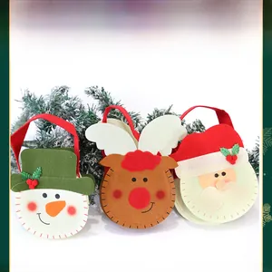 Detailed close-up of three festive felt Christmas gift bags with snowman and reindeer