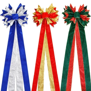 Large velvet Christmas tree topper bows with glitter accents in red, green and blue colors