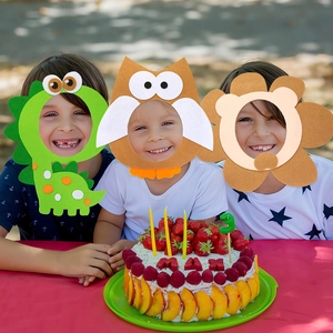 Three children wearing colorful felt animal masks at a fun outdoor birthday party celebration