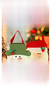 Detail of felt Christmas candy bags featuring 3D snowman and Santa Claus ornaments