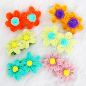 Handmade plush flower hair clips with colorful petal designs and metal duckbill pins