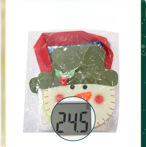 Detailed view of a Christmas felt snowman gift bag on a scale weighing 24.5 grams