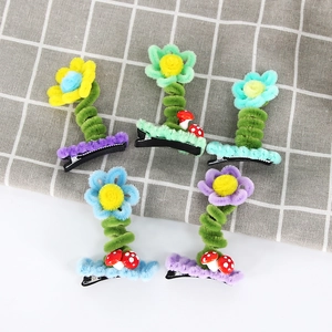 Set of five colorful plush flower hair clips with cute mushroom accents and metal duckbill clips